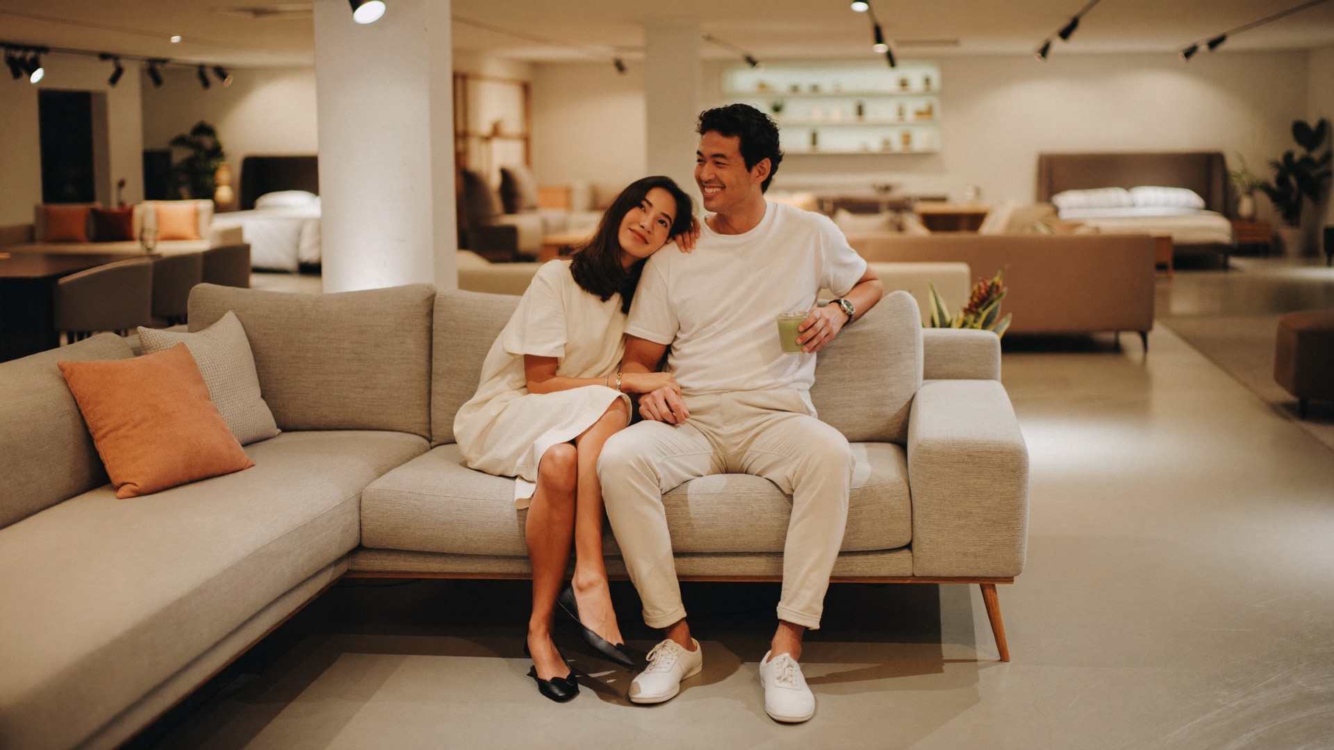A couple relaxing on a premium sofa at the Nova Furnishing showroom
